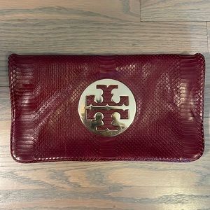 Tory Burch burgundy clutch, comes with strap
